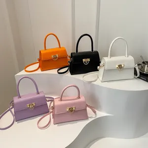 Chic solid color crossbody bags with gold V-hardware in five assorted vibrant colors