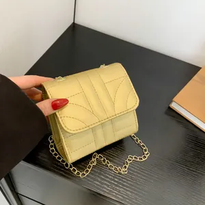 Fashionable beige chain crossbody bag with geometric stitching and gold chain strap