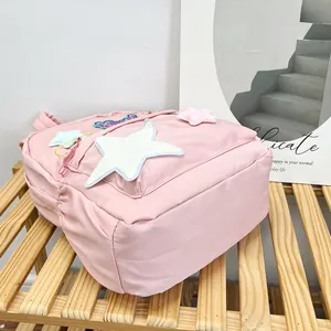 Pink large capacity student backpack with plush star embroidery and campus style design