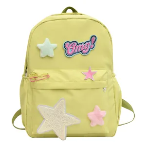 Yellow large capacity student backpack with cute plush star patches and Omg embroidery
