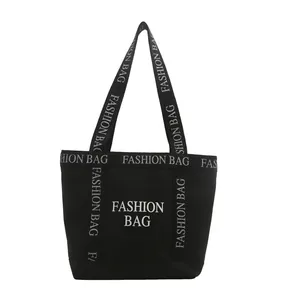 Sac cabas en toile noire avec lettrage fashion bag et grande capacité pour le travail