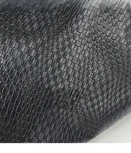 Close-up of the black woven texture and matte finish on this vintage casual tote bag
