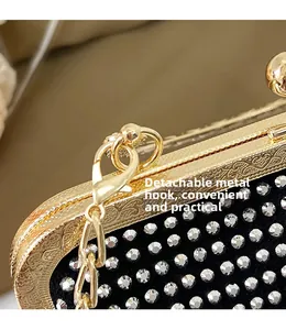Detail of detachable gold hardware hook and chain on rhinestone evening bag