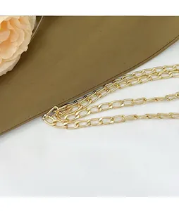 Detail of premium champagne gold metal chain strap with polished oval links for handbags
