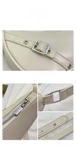 Close-up of beige saddle bag showing silver buckle, metal zipper and textured PU leather