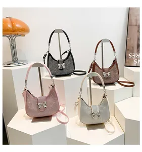 Chic rhinestone underarm bags with bow metal clasp in pink, black, brown, and white colors