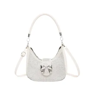 Fashionable white rhinestone hobo bag with large silver bow and versatile shoulder strap