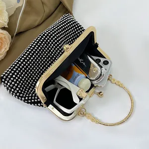 Sparkling silver rhinestone evening clutch with gold metal ring handle for women