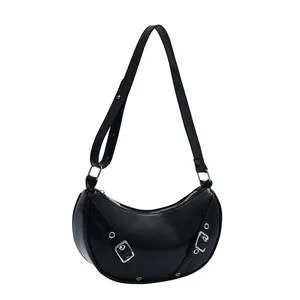 Fashionable black moon-shaped hobo saddle bag with silver buckles and adjustable shoulder strap