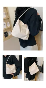 Close-up of cream nylon bag featuring elegant Pretty and liberty embroidery detail