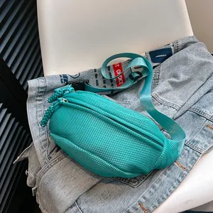 Detail of teal mesh waist bag showing breathable fabric and IT CHOICE red woven label
