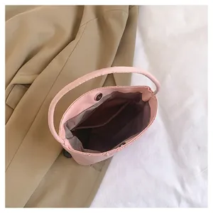 Top view of pink nylon tote interior with magnetic buckle and zip pocket