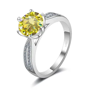 Macro shot of S925 silver ring featuring a large round yellow moissanite and side diamonds