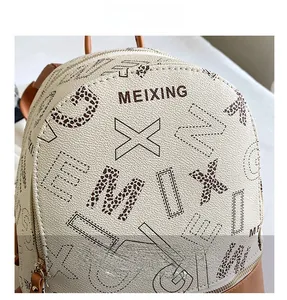 Detail of premium PU leather backpack with leopard print letters and brand logo