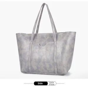 Side view of grey-purple marble pattern tote bag with front pocket and dual straps