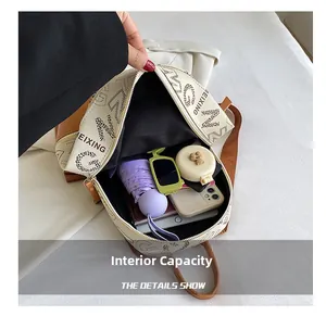 Top-down view of spacious internal capacity with umbrella, sunglasses and phone