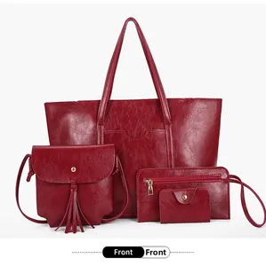 Macro detail of wine red 4-piece handbag set featuring glossy textured faux leather finish