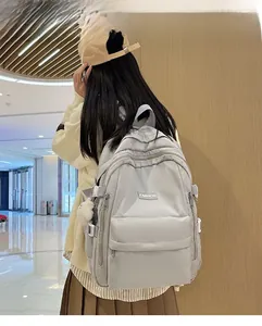 Large capacity grey nylon school backpack shown on 165cm model for size reference