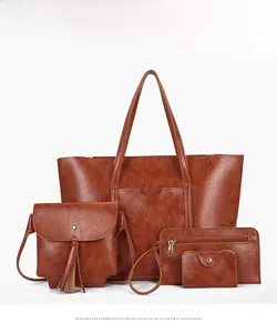 Detailed set of brown leather bags including tote, crossbody, wallet and card holder