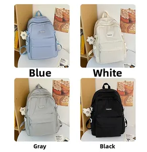 Collage of large school backpacks in blue, white, grey, and black with floral charms