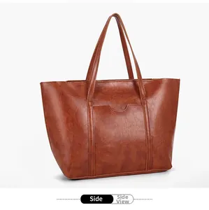 Slight side view of retro brown leather tote bag showing large capacity and smooth texture