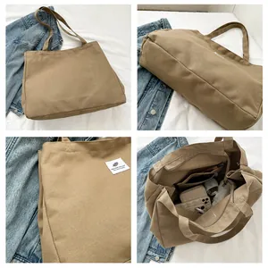Détails de la toile kaki montrant les compartiments intérieurs et la texture du tissu