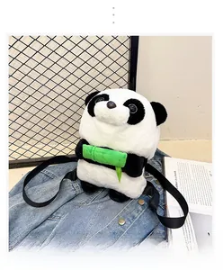 Close-up of panda plush backpack with bamboo detail on soft denim background