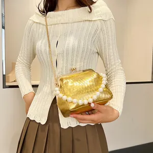 Pleated champagne gold shell clutch bag with pearl handle and metal chain for women