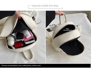 Internal view of cream lychee leather mini backpack showing spacious storage capacity
