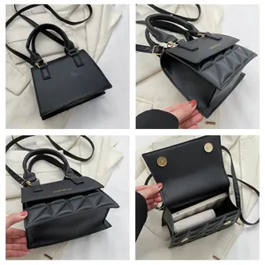 Details der schwarzen Trapez-PU-Ledertasche mit gesteppter Klappe und Goldbeschlägen
