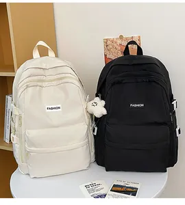 Detail view of Japanese style school backpacks in beige and black with side buckles