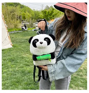 Outdoor shot of a cute panda plush backpack with adjustable straps and bamboo detail