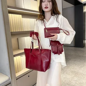 Burgundy 4-piece handbag set including large tote, crossbody bag, clutch and card holder