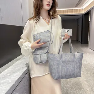 Blue marble patterned 4-piece handbag set including tote and crossbody bag with tassel
