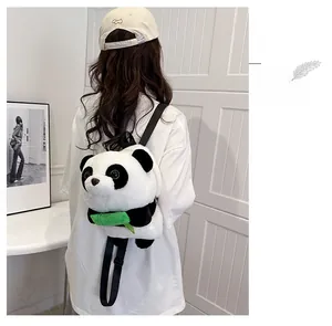 Rear view of a plush giant panda backpack with green bamboo accent and adjustable straps