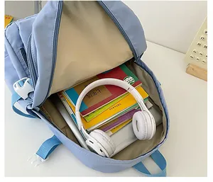 Interior detail of large capacity light blue backpack with laptop and tablet compartments