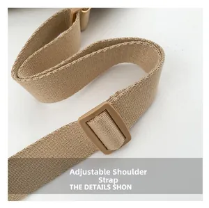 Detail of adjustable woven nylon shoulder strap with matte buckle for beige crossbody bag