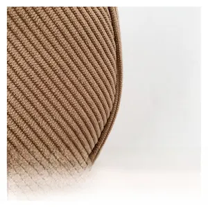 Detailed macro view of the premium brown corduroy fabric with vertical striped texture