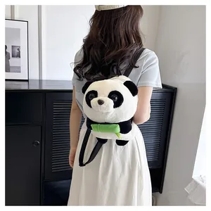 Detailed back view of a cute panda plush backpack featuring green bamboo and black straps
