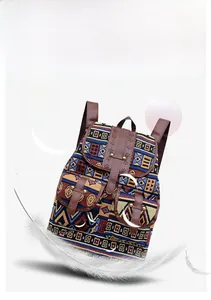 Close-up of bohemian backpack featuring colorful jacquard patterns and brown leather trim