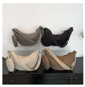Detailed corduroy texture on crescent shoulder bags with matching round coin purses