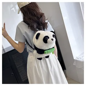 Toddler wearing a cute plush panda backpack with bamboo detail in a sunny outdoor setting