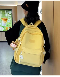 Close-up of a bright yellow backpack with high-quality nylon fabric and logo detail
