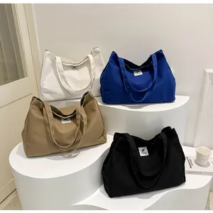 Détails des sacs fourre-tout en toile en blanc, bleu, kaki et noir de grande capacité