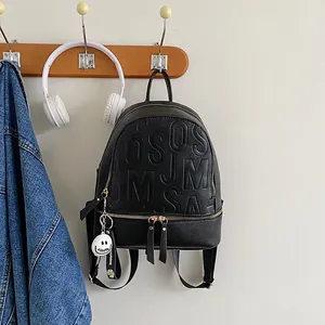 Waterproof black leather backpack with embossed letters and stylish daisy charm