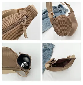 Detail of brown corduroy crossbody dumpling bag showing texture and small round pouch