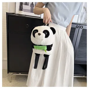 Close-up of plush panda backpack with green bamboo accent and adjustable black straps