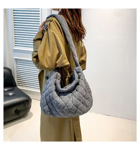 Close-up of quilted corduroy texture and large capacity design on grey tote bag