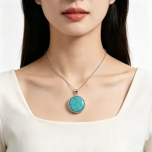 Detail of S925 sterling silver turquoise pendant necklace worn on female model
