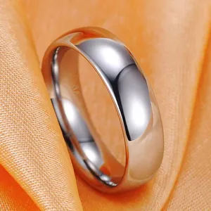 Macro view of polished stainless steel ring with mirror finish on orange silk